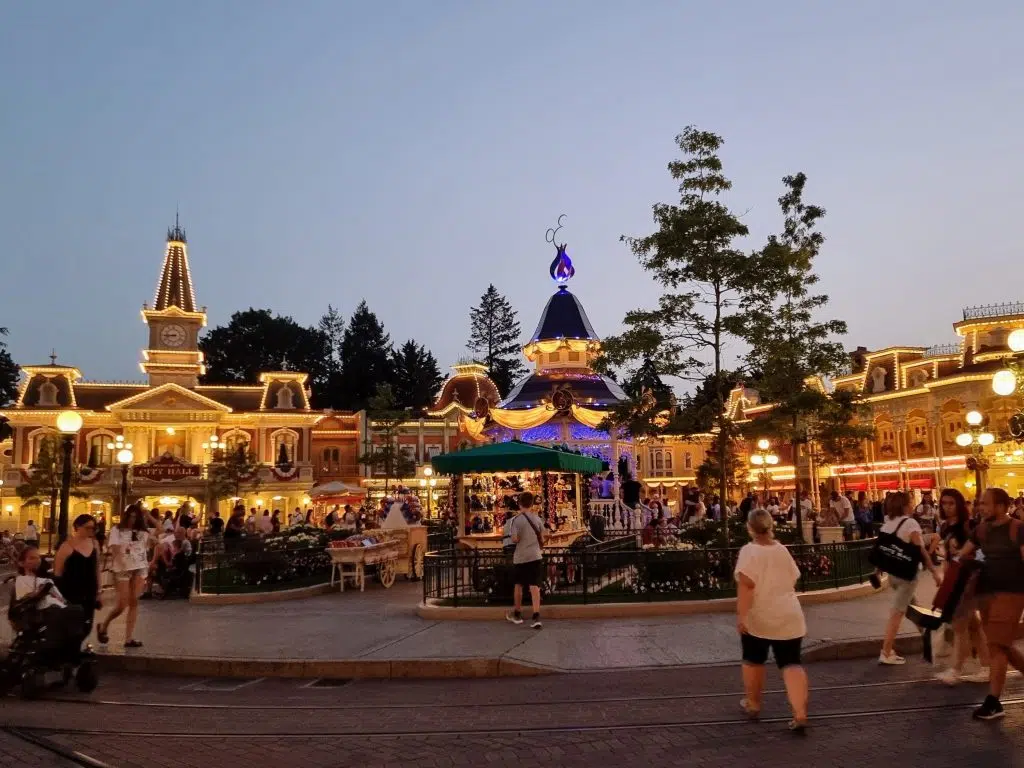 disneyland paris holiday guide and review, frugal mum travel guide, photo of main street at night lit up