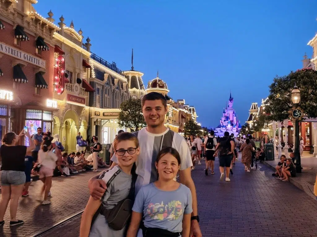 disneyland paris holiday guide and review, frugal mum travel guide, photo of main street at night with castle