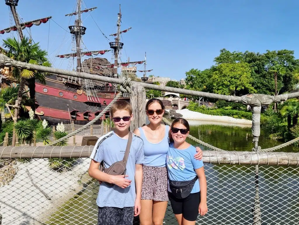 disneyland paris holiday guide and review, frugal mum travel guide, photo of family by pirates of the caribbean ship