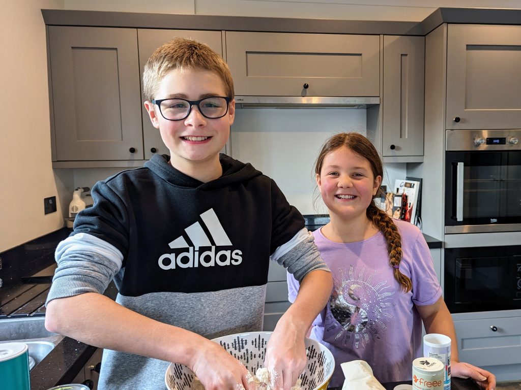 Family Frugal Living Guide, simple tips to save you money, frugal mum guide, photo of children cooking