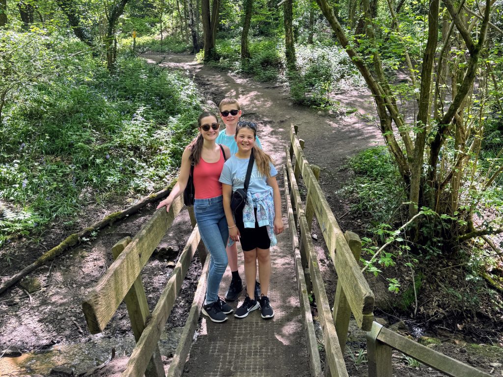 Family Frugal Living Guide, simple tips to save you money, frugal mum guide, photo of mum and children on nature walk