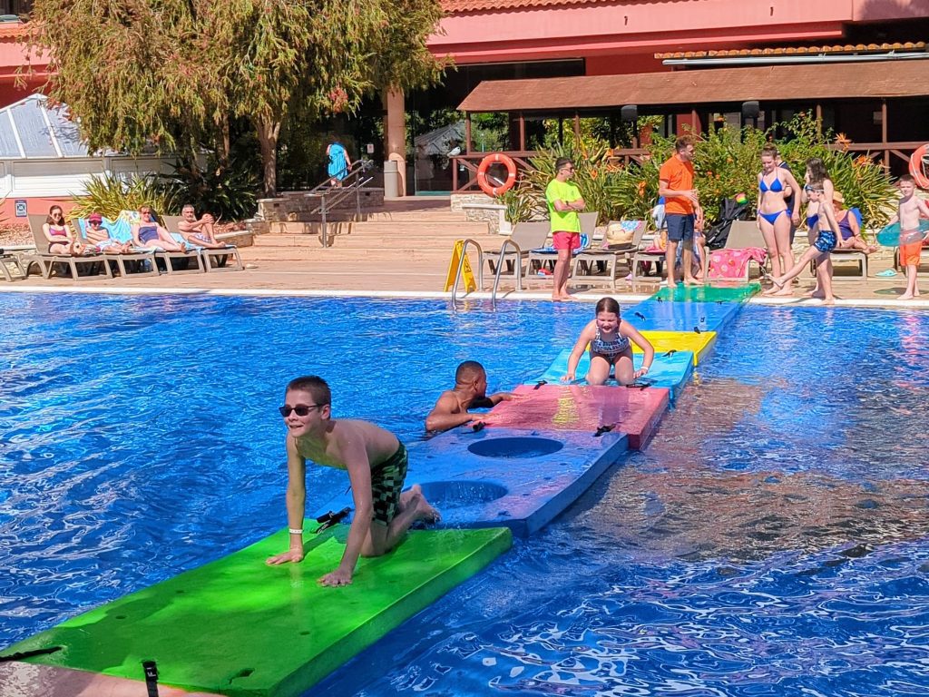 How to home educate on a budget, UK discounts, freebies & tips for travel, resources & days out guide, photo of frugal mum children at villa romana salou spain TUI