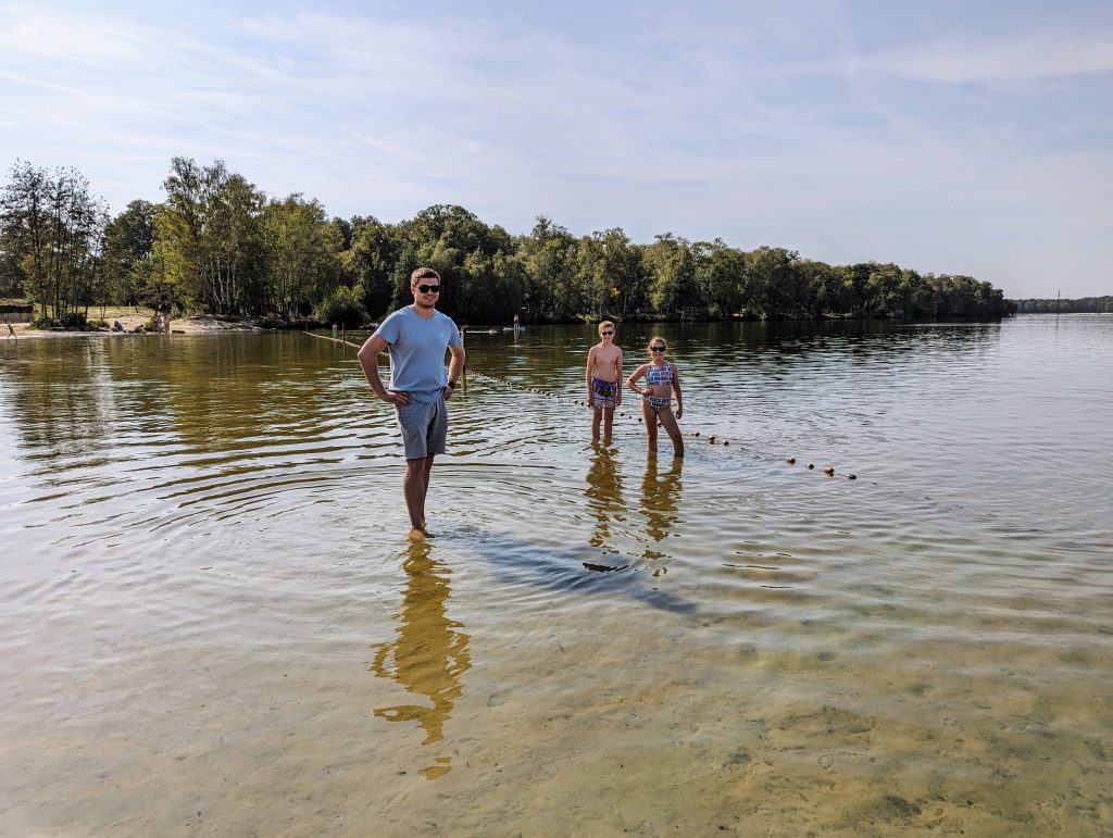 Beekse Bergen Lake Resort, Eurocamp holiday review, the Netherlands, frugal mum children and husband paddling in lake, photo