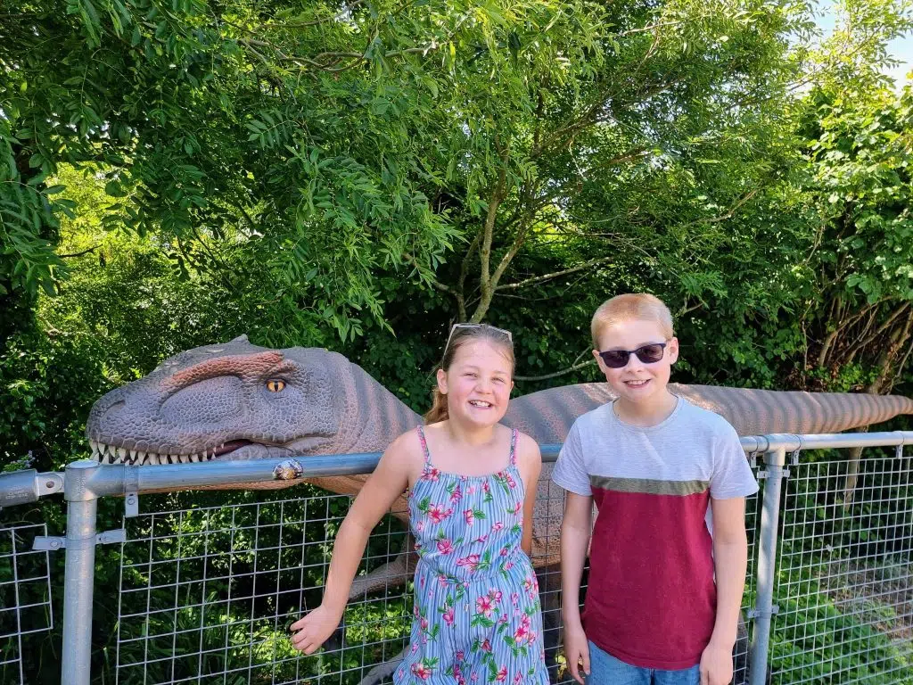 Parkdean Resorts Lower Hyde Review, Isle of Wight, frugal mum UK travel guide, photo of children by dinosaur at blackgang chine