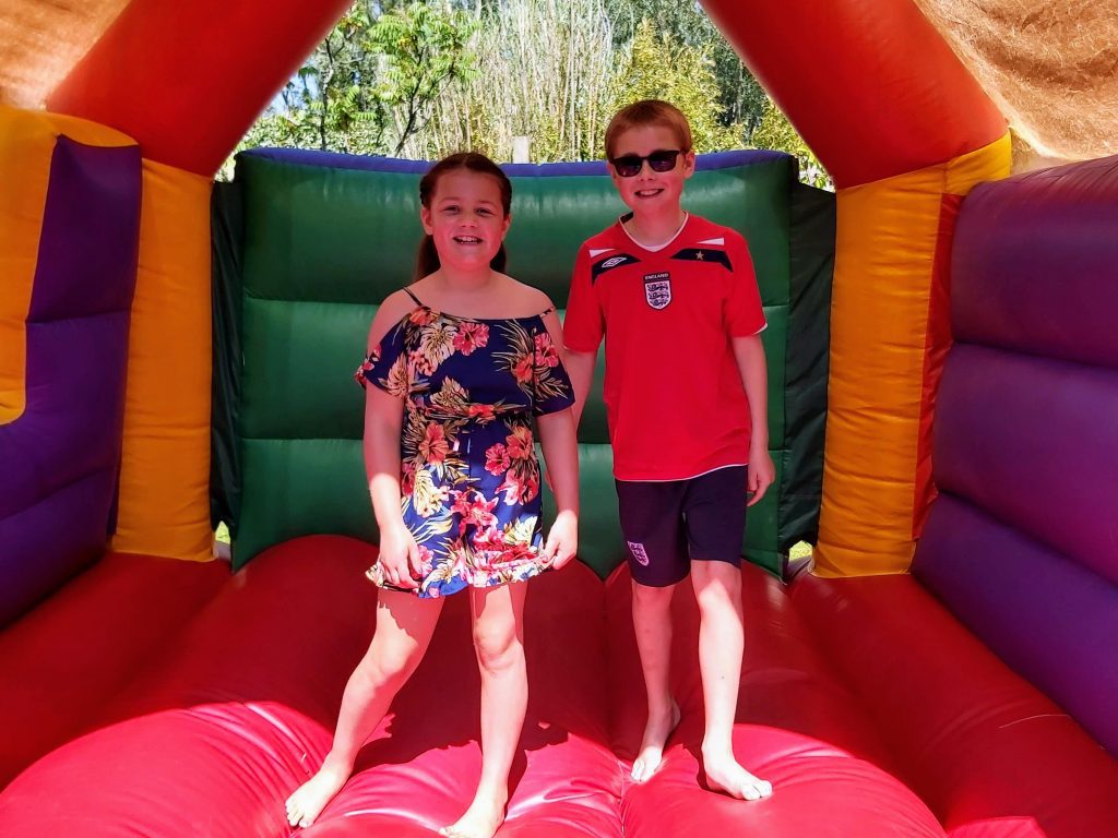 cheap days out with the kids, weekend, school holidays budget family fun guide, frugal mum, photo of children on bouncy castle