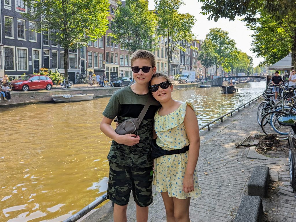 why eurocamp to travel in europe with kids, frugal mum guide, photo of children by canal in amsterdam