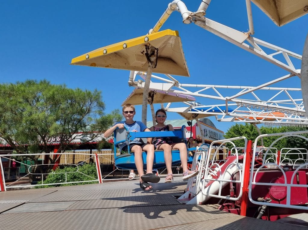 The Ultimate Butlins Minehead Holiday Guide & Review, frugal mum photo of children on rides