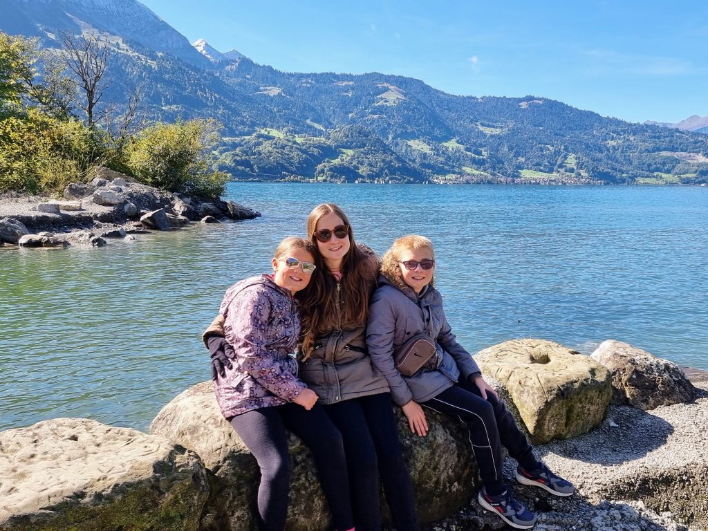 Switzerland with kids, How to spend a day in Bern on a budget, photo of frugal mum and kids by lake Thun