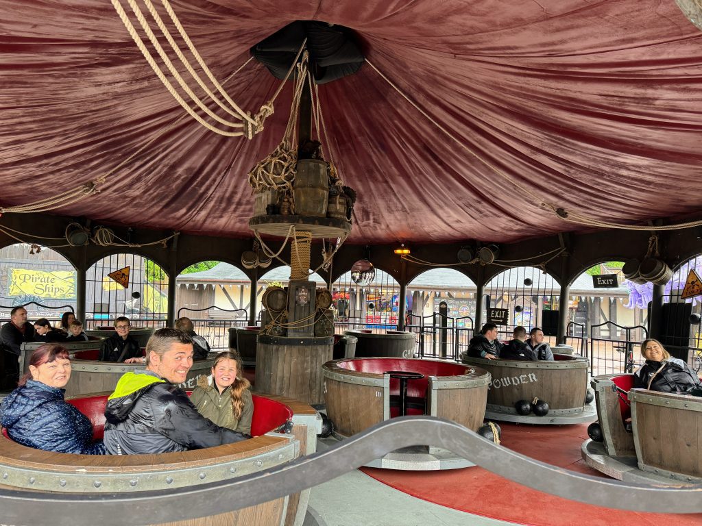 Alton Towers theme park with kids , family review, discount tickets and tips, frugal mum photo of family on ride