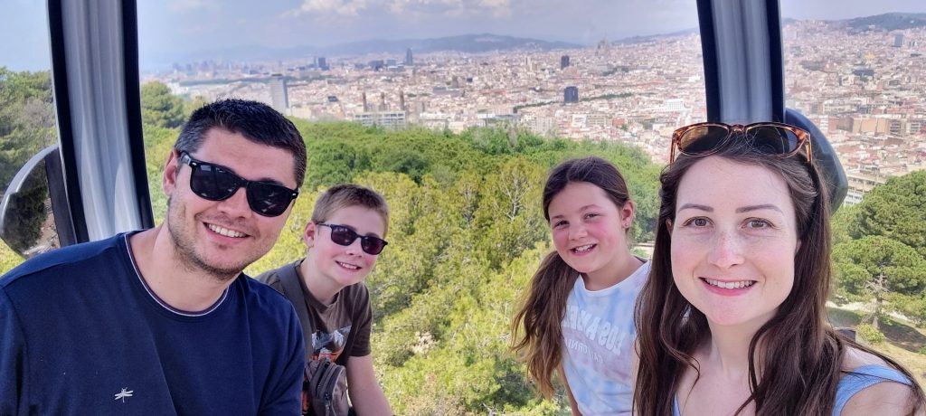 The best things to do in Barcelona on a budget with kids, frugal mum travel guide, photo of family on cable car