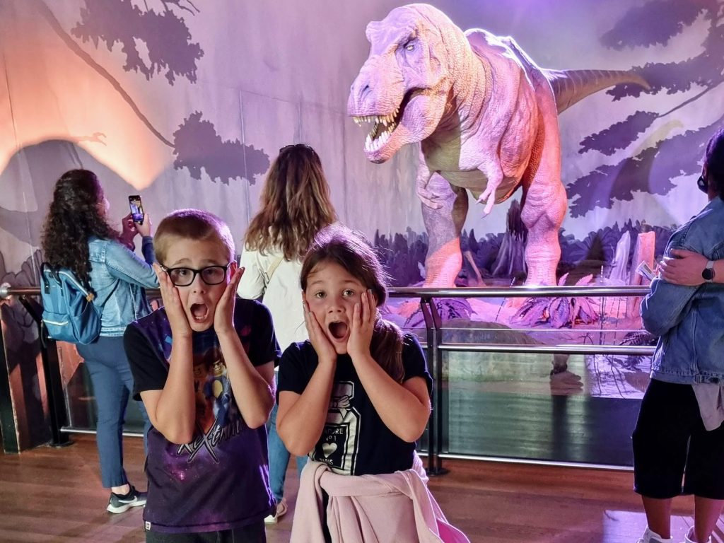 How to home educate on a budget, UK discounts, freebies & tips for travel, resources & days out guide, photo of frugal mum children at national history museum