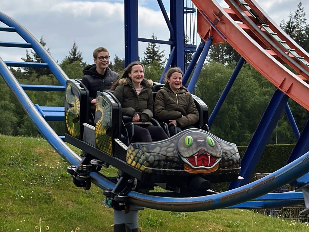 A family review and guide for Paultons Park & Peppa Pig World, frugal mum photo of family on rollercoaster