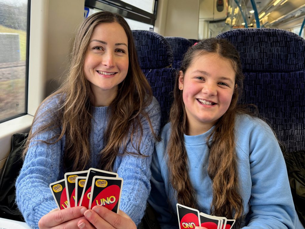 UK family budget travel, cheap staycation holiday, frugal mum tips, photo on train