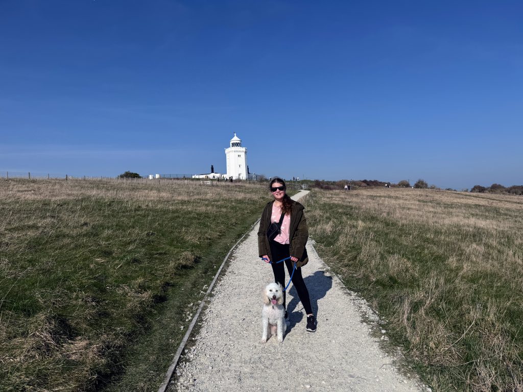 Kent with Kids, The National Trust White Cliffs of Dover Walk, frugal mum guide, photo of child and dog by lighthouse