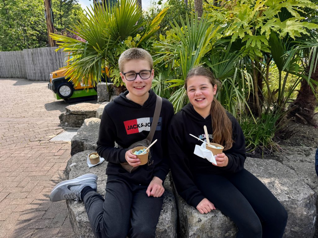 Chessington Resort Guide, is the Safari or Azteca hotel better, frugal mum review, photo of kids eating ice cream in theme park