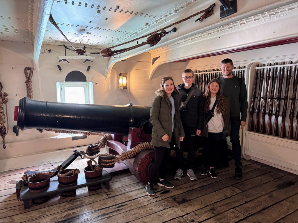 Portsmouth Historic Dockyard with Kids, the ultimate family guide from frugal mum, photo of family onboard HMS warrior