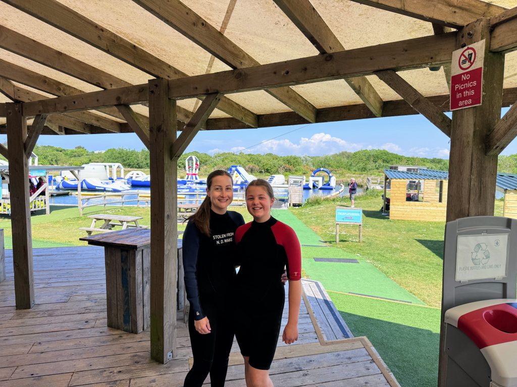 North Devon Wake Park with kids - our aqua park review, frugal mum guide, photo of family by lake
