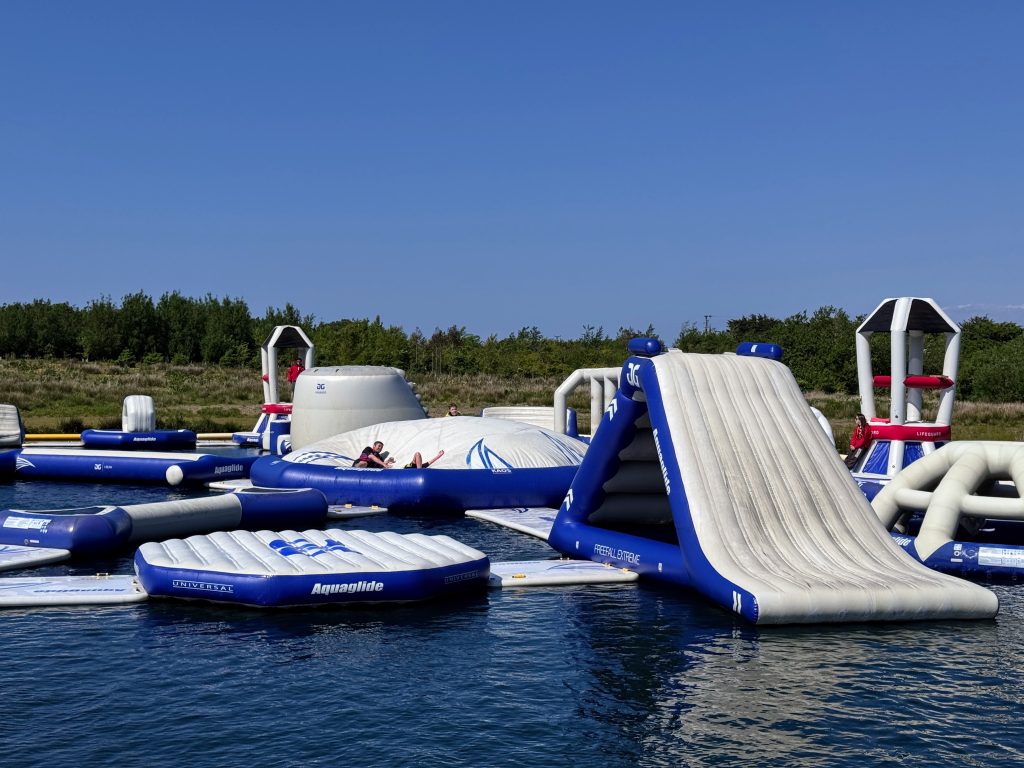 North Devon Wake Park with kids - our aqua park review, frugal mum guide, photo of family on lake