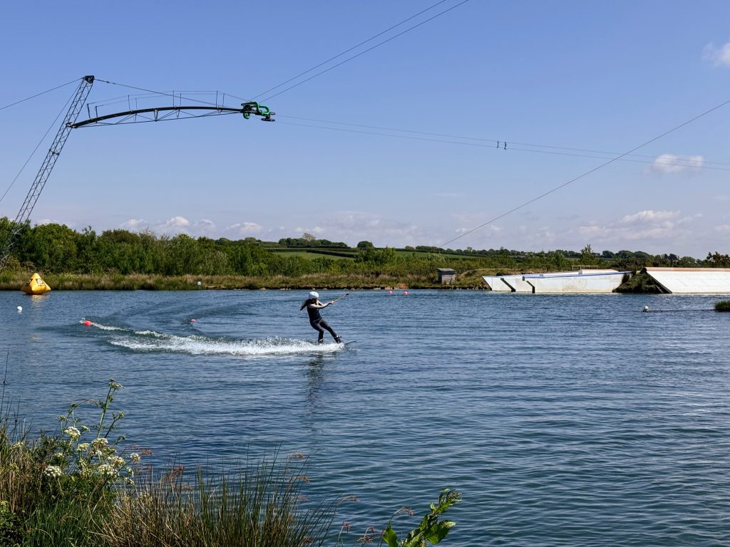North Devon Wake Park with kids - our aqua park review, frugal mum guide, photo of wakeboarding