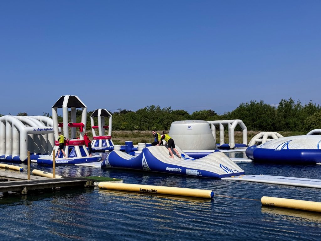 North Devon Wake Park with kids - our aqua park review, frugal mum guide, photo of family on lake