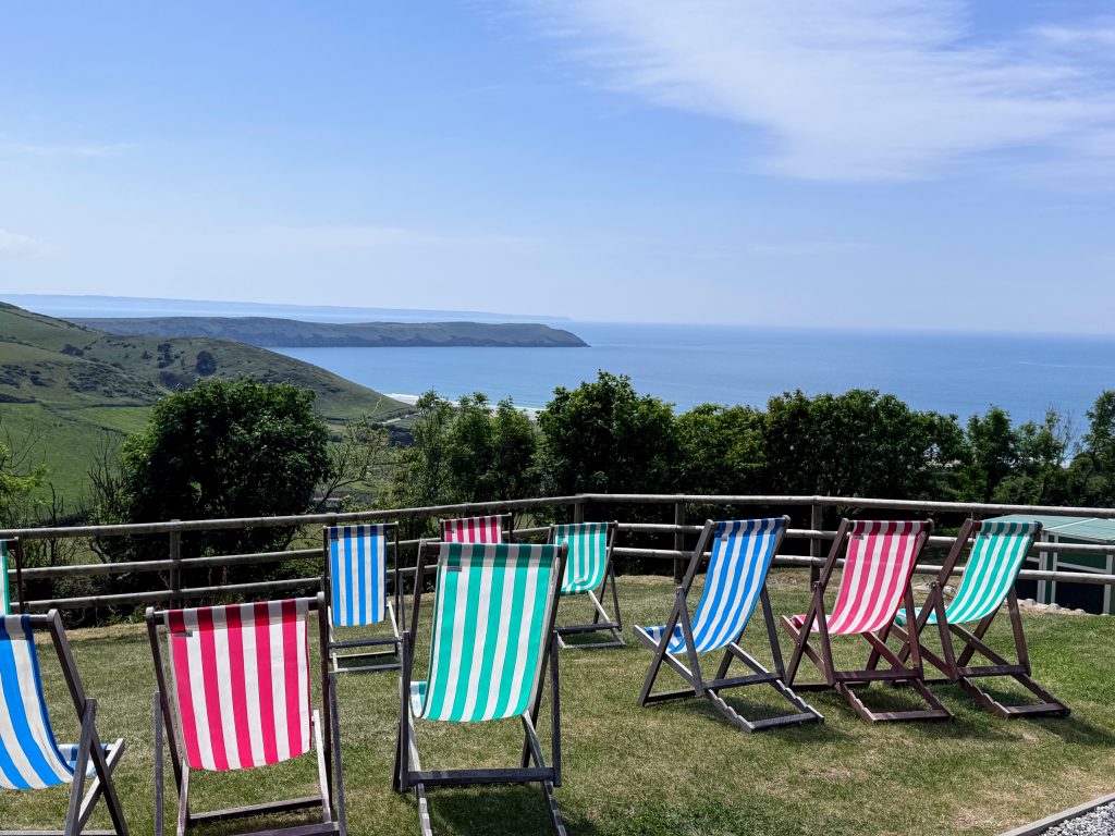 North Devon with Kids, Woolacombe Bay and Twitchen House Holiday Park Review, frugal mum, photo of view of woolacombe beach from pool