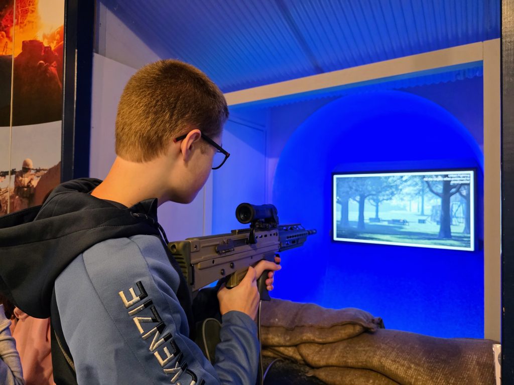 Visiting Dover Castle with kids, a fun family day out guide, frugal mum photo of child playing shooting game