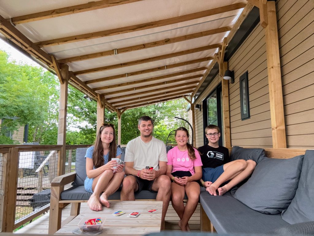Eurocamp Holiday Review, Le Pin Parasol, Vendée, France, frugal mum travel guide, photo of family on ultimate plus decking