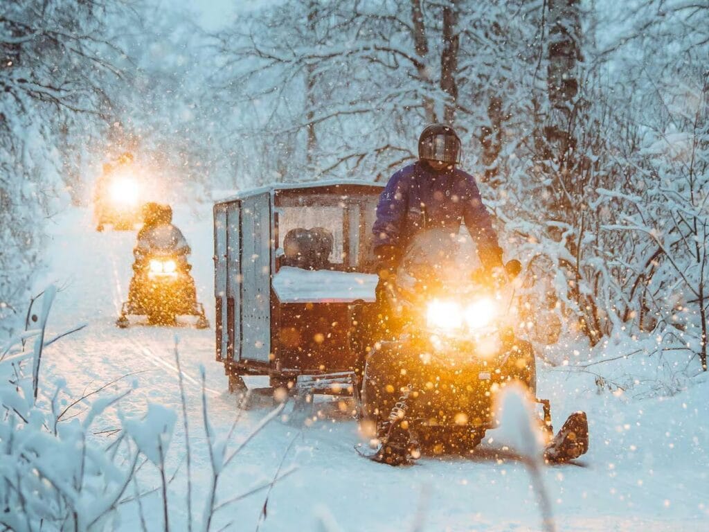The 5 best Rovaniemi snowmobile tours for families, frugal mum lapland travel guide, photo of family snowmobile tour
