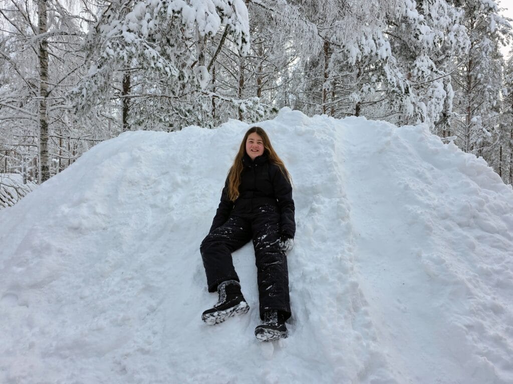 Santa Claus Village Rovaniemi frugal mum travel guide, photo of girl in snow