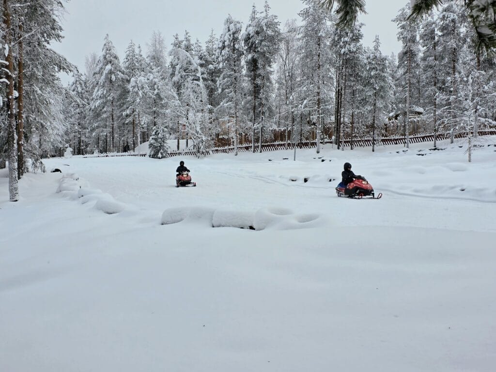 Santa Claus Village Rovaniemi frugal mum travel guide, photo of mini snowmobiles