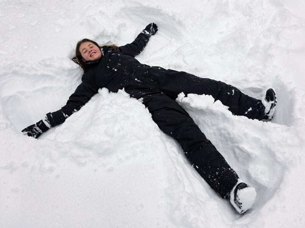 How many days do you need in Rovaniemi with kids, frugal mum travel guide, photo of child making snow angel