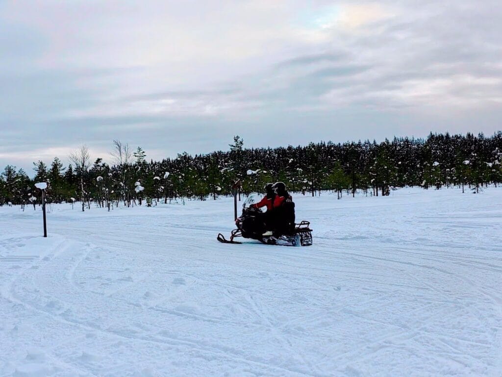 Snowmobile Safari in Rovaniemi with kids our honest review, frugal mum lapland travel guide, photo of safari with nordicunique travels