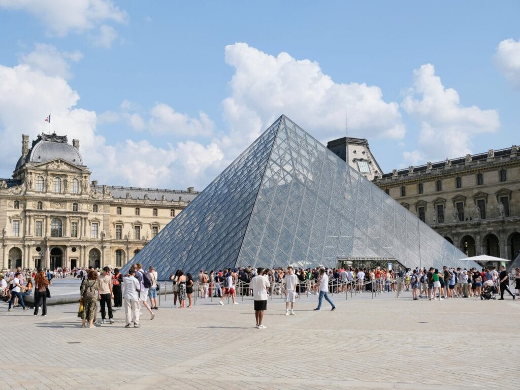 Best Time to Visit Paris with Kids Month by Month Guide, frugal mum travel guide, photo of louvre in summer