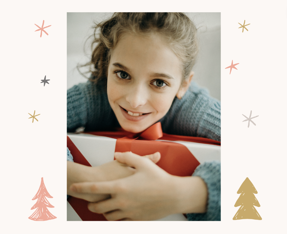 child smiling with christmas gift