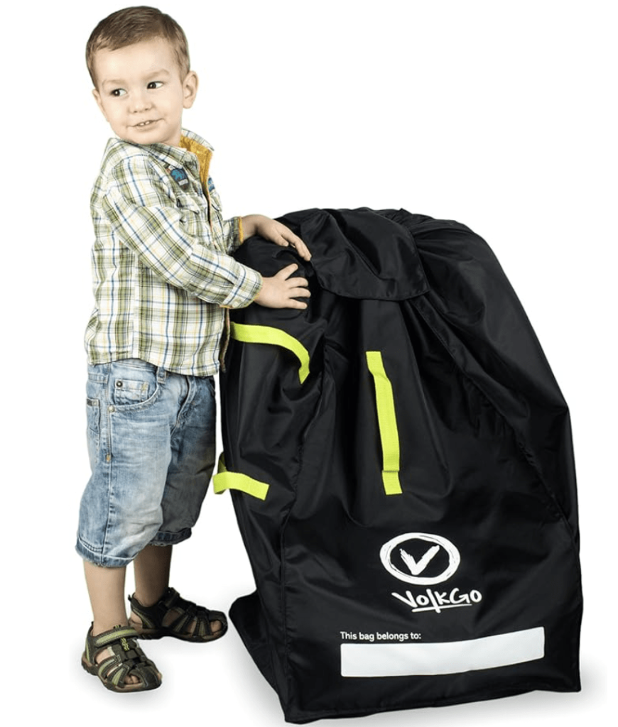 How to hire a car abroad cheaply: Guide, money saving tips & debit card options, car seat bag image with child