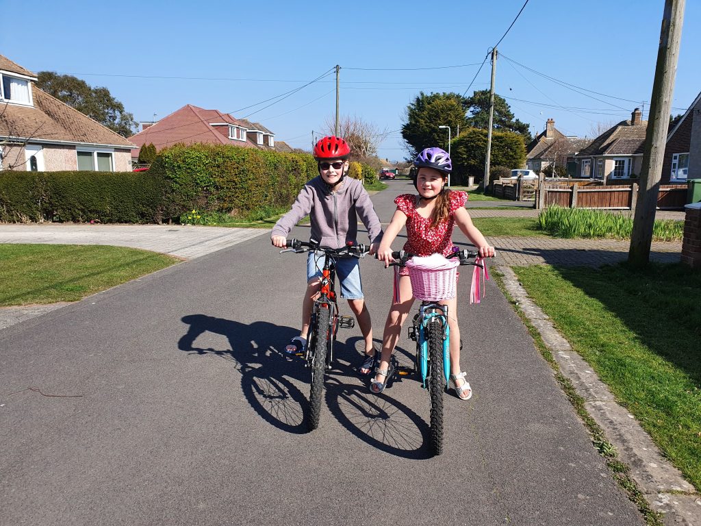 Family Frugal Living Guide, simple tips to save you money, frugal mum guide, photo of children on bike ride