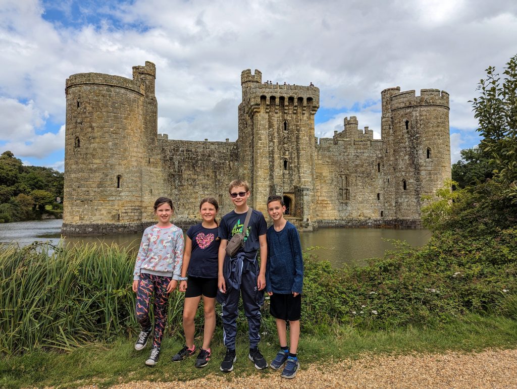 bodiam castle review, national trust, east sussex with kids, frugal mum guide, photo of children in grounds