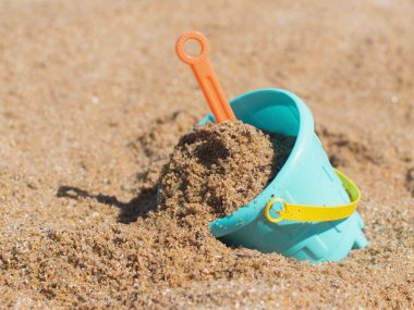 beach bucket in sand