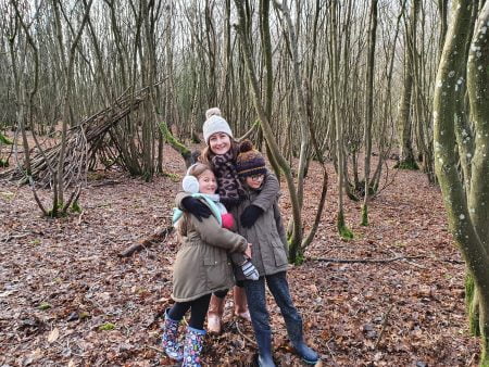 frugal mum with children in woods, wrapped up, winter