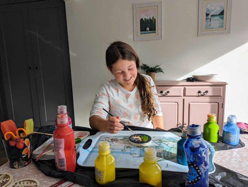 Family Frugal Living Guide, simple tips to save you money, frugal mum guide, photo of child painting