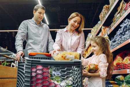 family shopping with little girl at store, cookbook, frugal mum, save money on food shop tips