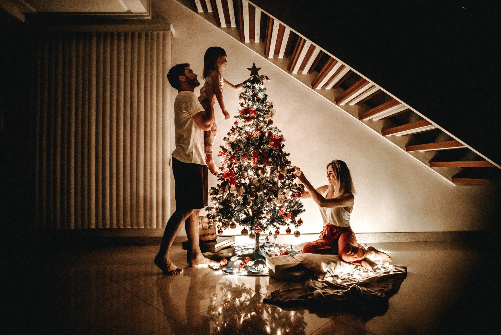 family decorating simple christmas tree