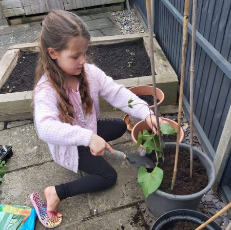 Easter holiday activities on a budget, 15 ways to have DIY family fun with the kids, frugal mum tips, photo of child gardening