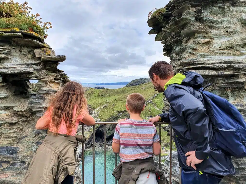 How to home educate on a budget, UK discounts, freebies & tips for travel, resources & days out guide, photo of frugal mum children at tintagel castle