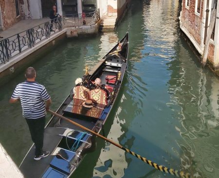 travelling on a budget tips, venice, people on a gondola, frugal mum family holiday photo, eurocamp, cisano san vito