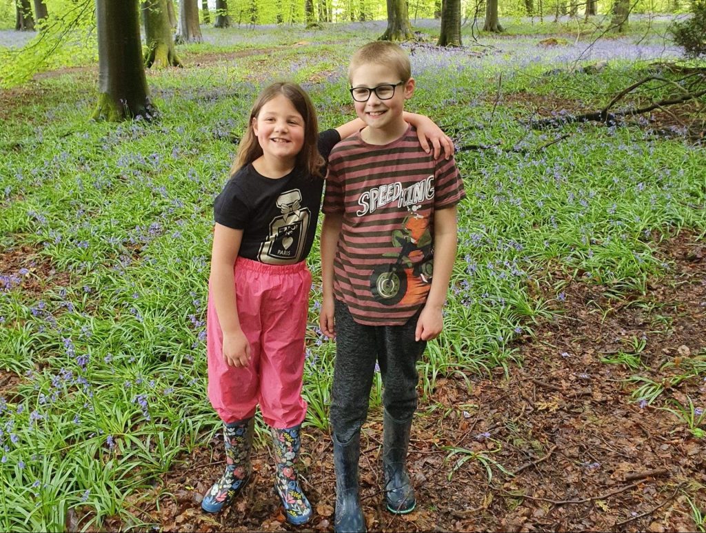 Cheap UK Days Out, Kids discounts for 2026 easter holidays, frugal mum guide, photo of kids in bluebells